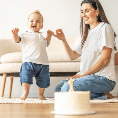 Mom and toddler aged son celebrating birthday, representing developmental milestones for kids