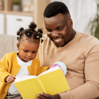 Father reading with young child, representing reading tips for parents